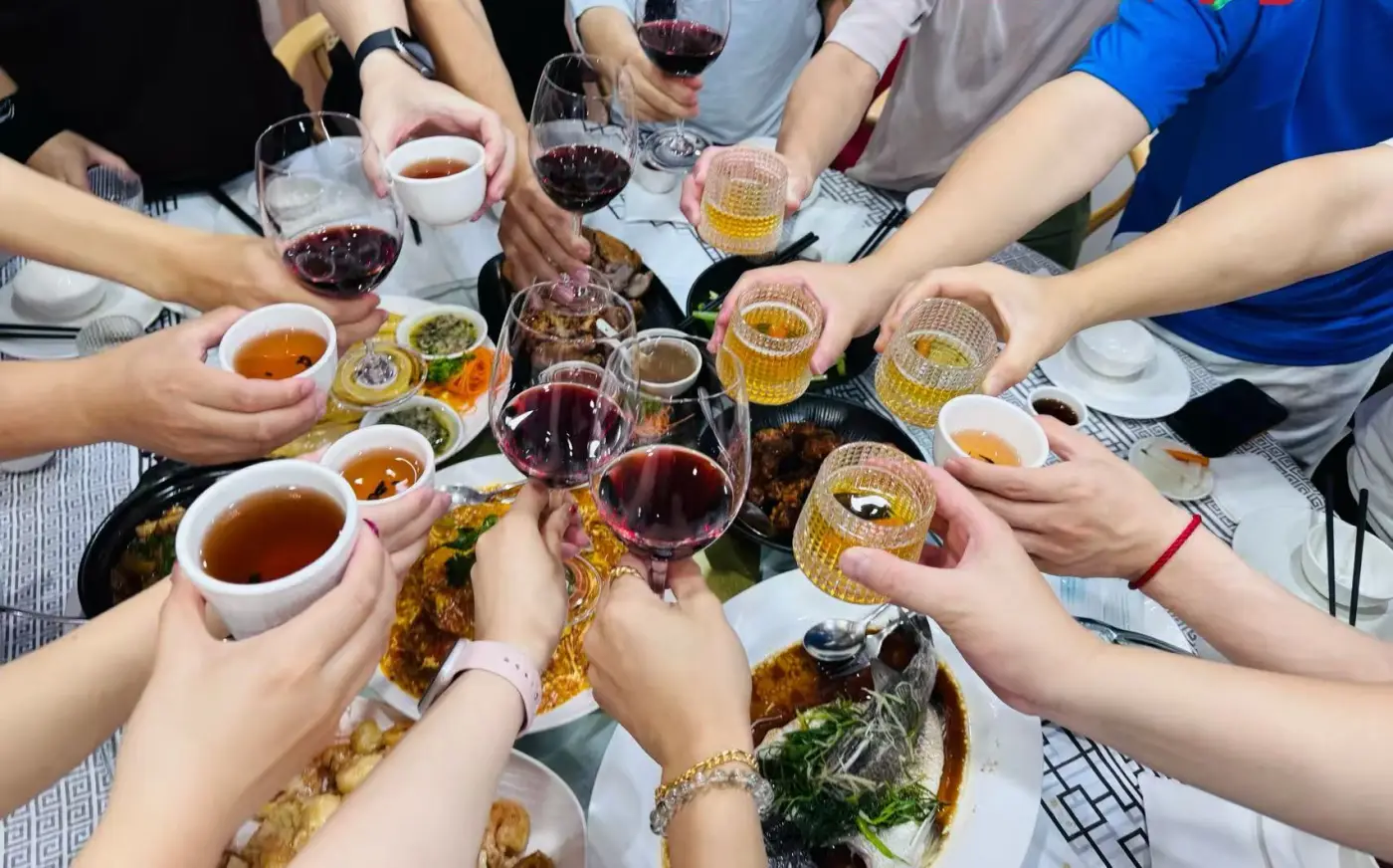 Club members raising a toast together at a Lunar New Year dinner